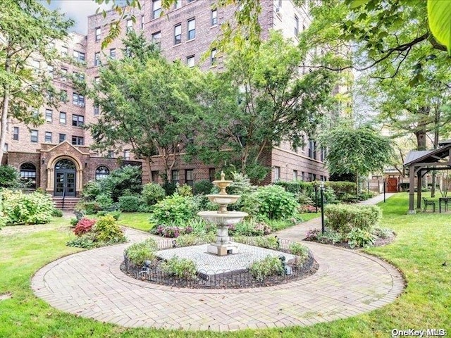 surrounding community with a yard and a gazebo