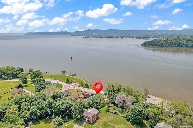 birds eye view of property featuring a water and mountain view