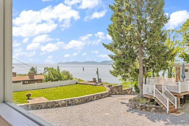 view of yard with a water and mountain view