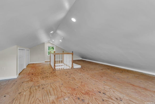 bonus room featuring light hardwood / wood-style floors and lofted ceiling