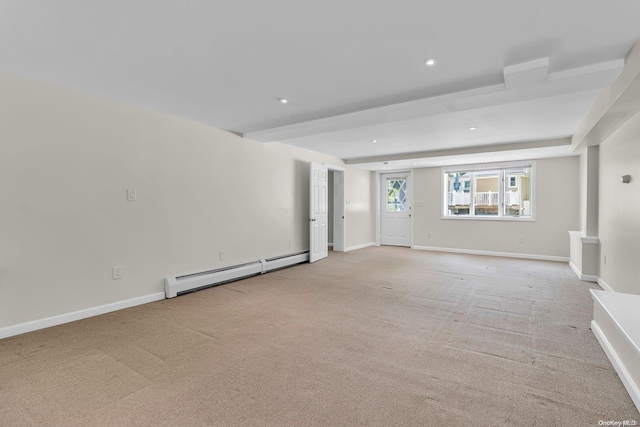 unfurnished living room with light colored carpet and a baseboard radiator