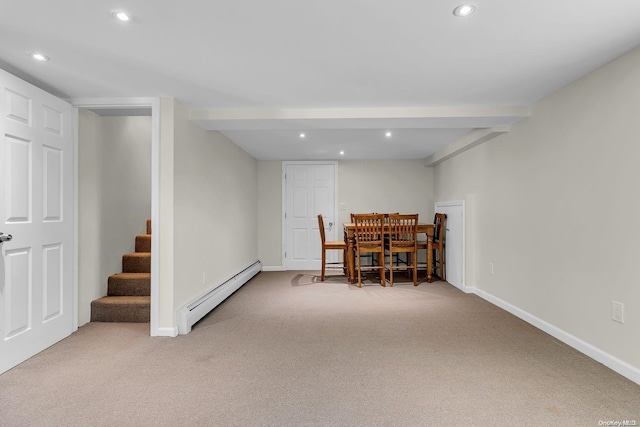 interior space with baseboard heating, light carpet, and beamed ceiling