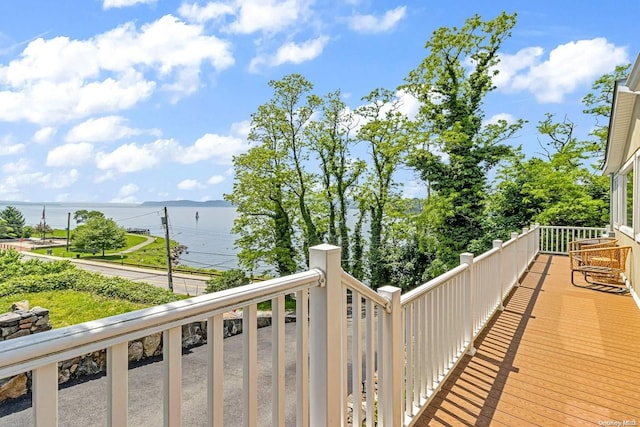 balcony featuring a water view