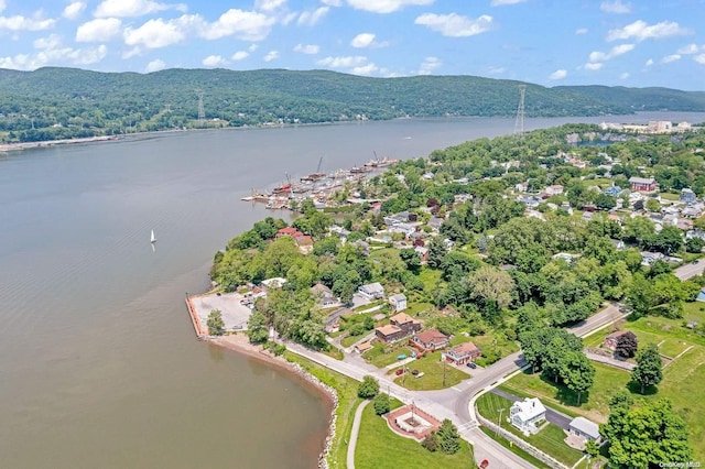 aerial view featuring a water and mountain view