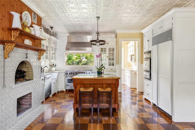 75 Oak Neck Ln, West Islip, NY 11795 - kitchen featuring high end appliances, wall chimney range hood, dark wood finished floors, a chandelier, and a kitchen island with sink