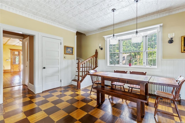 75 Oak Neck Ln, West Islip, NY 11795 - dining area featuring stairway, wainscoting, an ornate ceiling, crown molding, and wood finished floors