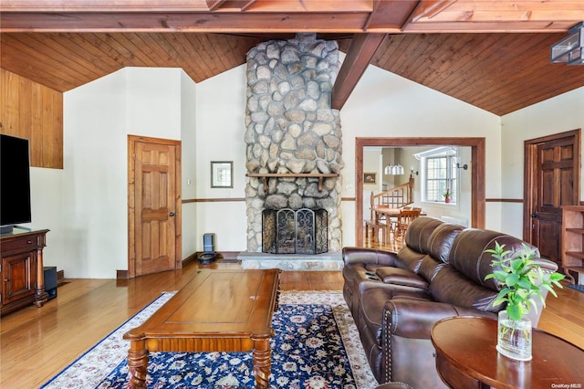 75 Oak Neck Ln, West Islip, NY 11795 - living room featuring wood ceiling with exposed beams, wood finished floors, a fireplace, and high vaulted ceiling