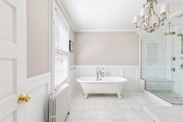 75 Oak Neck Ln, West Islip, NY 11795 - bathroom featuring radiator heating unit, wainscoting, healthy amount of natural light, a stall shower, and a decorative wall