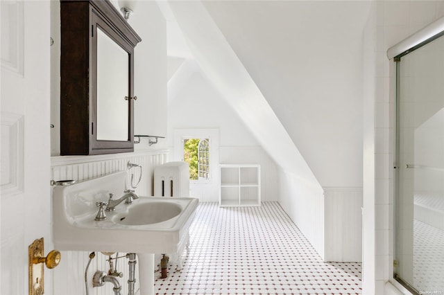 75 Oak Neck Ln, West Islip, NY 11795 - full bath featuring a stall shower, lofted ceiling, and wainscoting