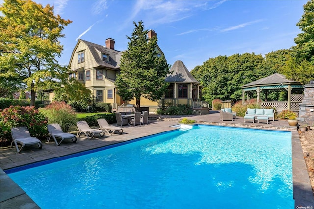 75 Oak Neck Ln, West Islip, NY 11795 - outdoor pool with a gazebo, an outdoor hangout area, and a patio