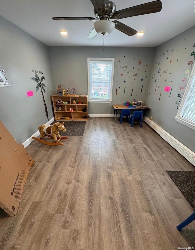 misc room featuring hardwood / wood-style floors and ceiling fan