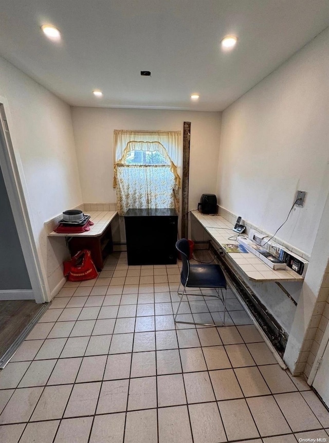 office area with light tile patterned floors