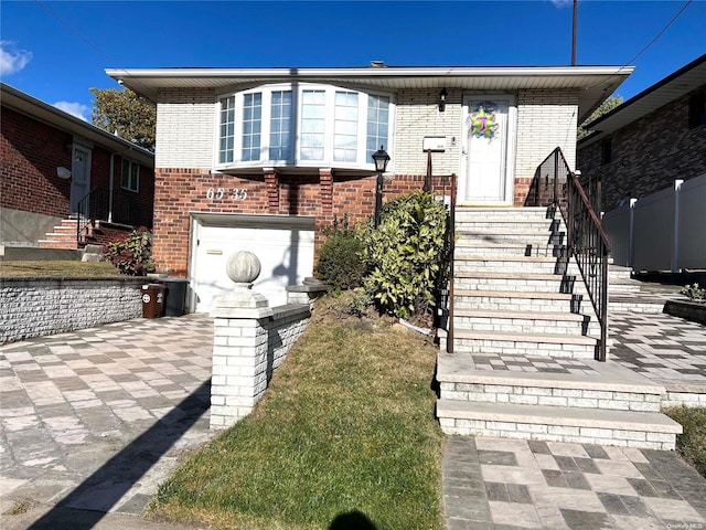 view of front of home with a garage