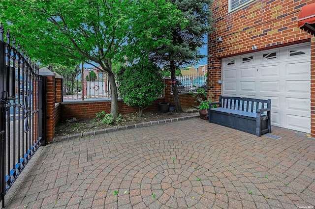 view of patio / terrace with a garage