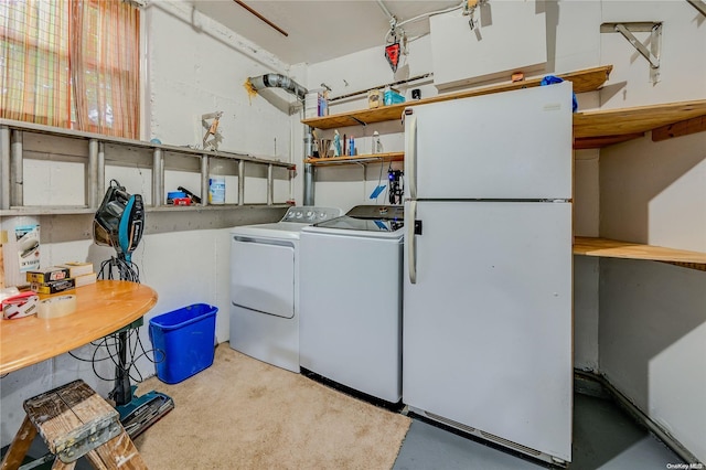 clothes washing area with separate washer and dryer