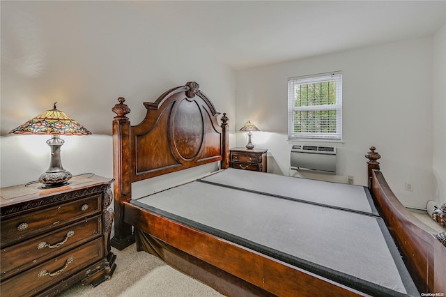 bedroom with a wall unit AC and light carpet