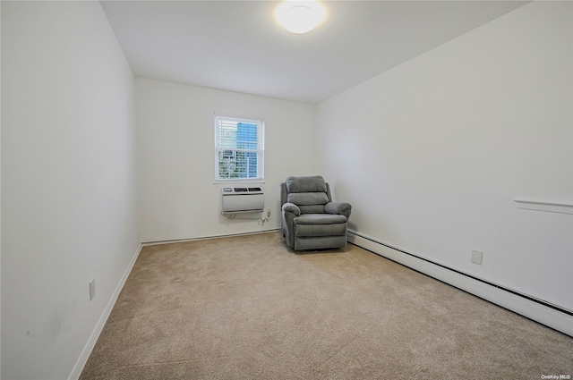 sitting room with a wall mounted AC, light colored carpet, and baseboard heating