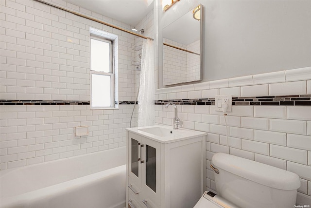 bathroom with shower / bath combination with curtain, tile walls, and vanity