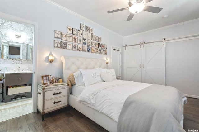 bedroom featuring dark hardwood / wood-style floors, ceiling fan, a barn door, and ornamental molding