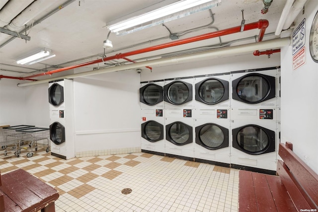 washroom featuring separate washer and dryer and stacked washing maching and dryer