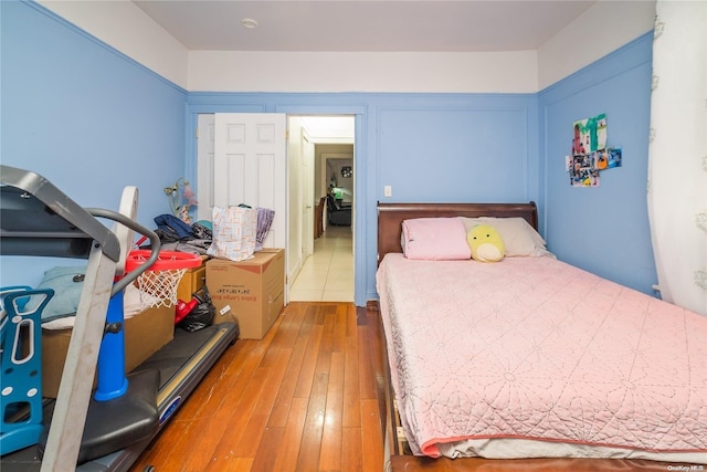 bedroom with hardwood / wood-style flooring