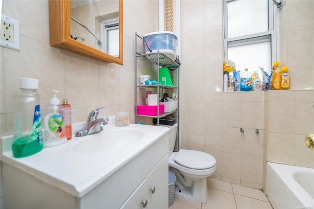 bathroom featuring plenty of natural light and tile walls