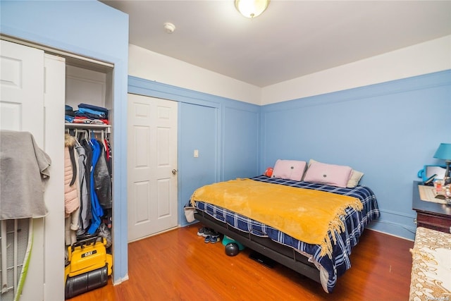 bedroom with hardwood / wood-style flooring