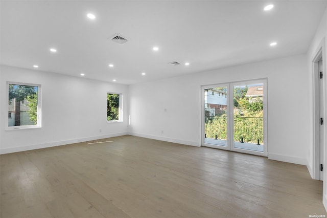 unfurnished room with light hardwood / wood-style floors