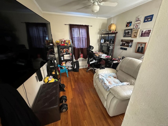 office featuring a ceiling fan, crown molding, and hardwood / wood-style flooring