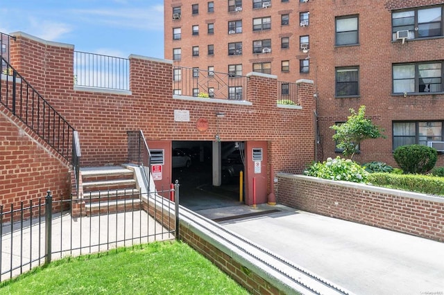 view of property featuring a garage and cooling unit