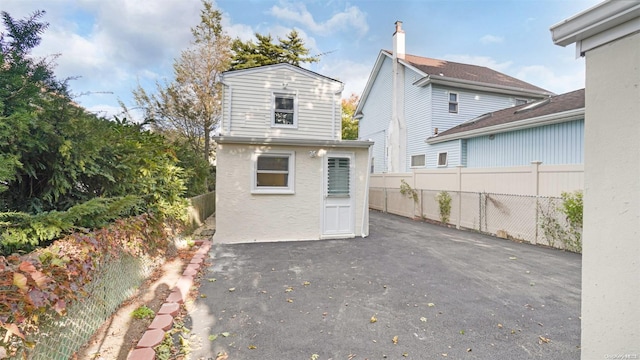 back of house with a patio