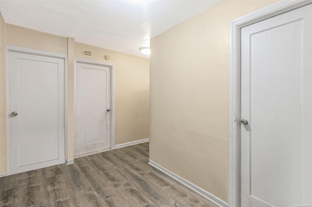 corridor with dark hardwood / wood-style floors