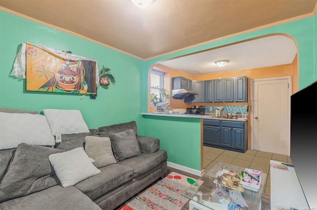 living room with crown molding and light tile patterned floors