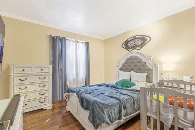 bedroom featuring ornamental molding and dark wood-type flooring