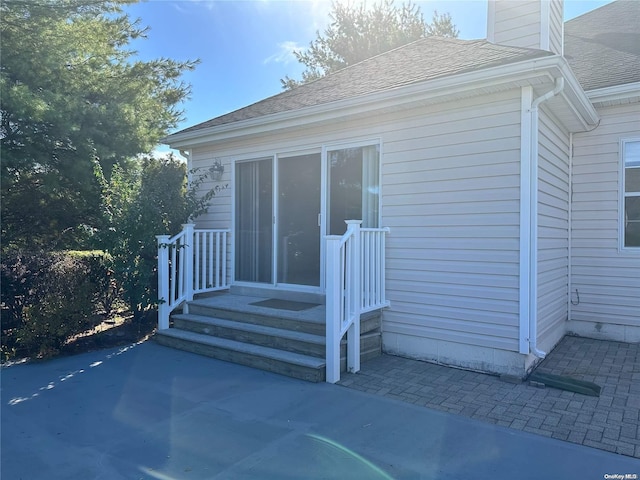 entrance to property with a patio