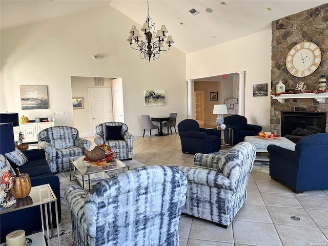 living room featuring light tile patterned flooring, a fireplace, a chandelier, and high vaulted ceiling