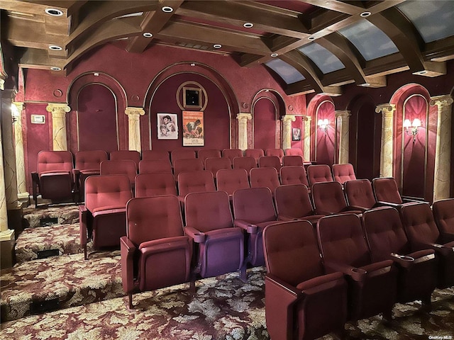 home theater room with vaulted ceiling with beams, coffered ceiling, and ornate columns