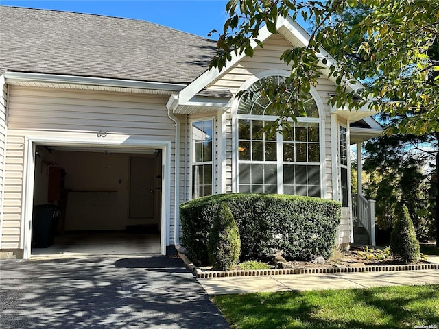 view of side of home featuring a garage