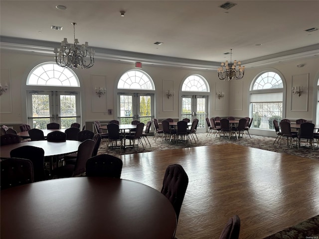 dining room featuring french doors, dark hardwood / wood-style flooring, and a notable chandelier