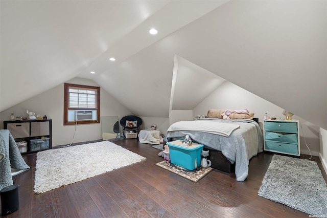 bedroom featuring dark hardwood / wood-style floors, cooling unit, and vaulted ceiling