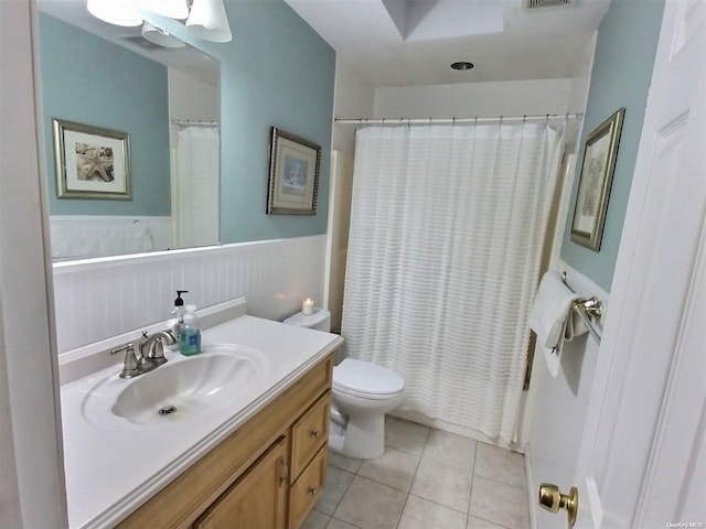 bathroom with tile patterned floors, vanity, toilet, and a shower with shower curtain