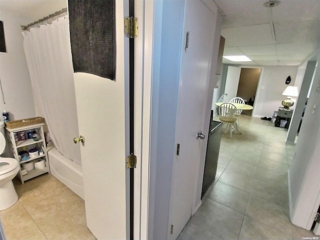 hallway featuring light tile patterned flooring