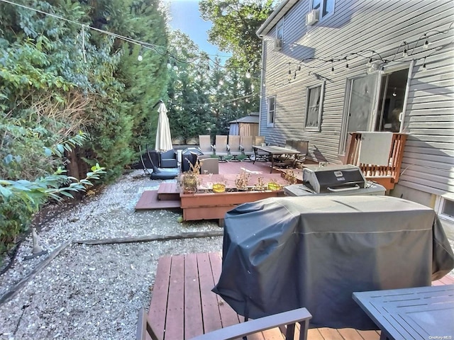 wooden deck with grilling area