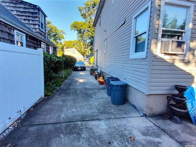 view of side of property with cooling unit