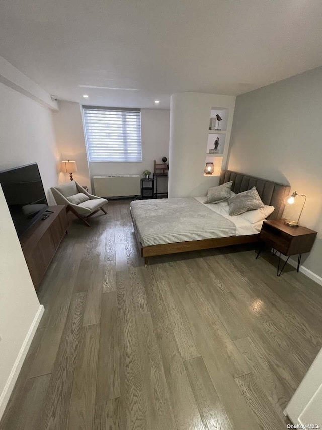 bedroom featuring hardwood / wood-style flooring