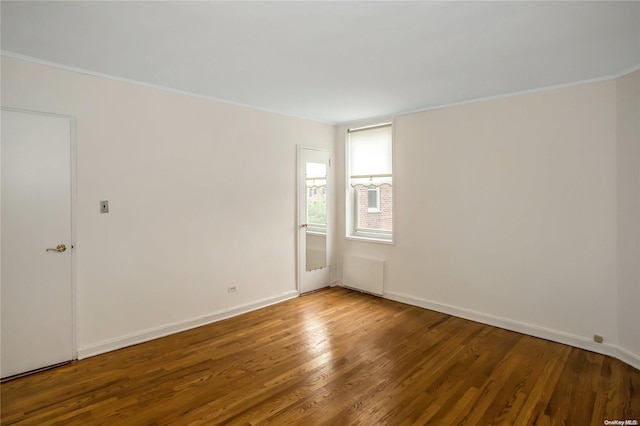 unfurnished room featuring hardwood / wood-style floors