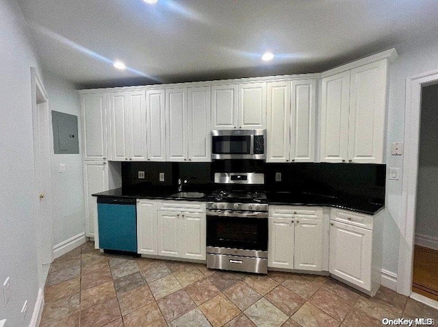 kitchen with electric panel, white cabinetry, sink, and stainless steel appliances