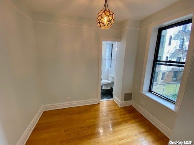 unfurnished room with light hardwood / wood-style flooring