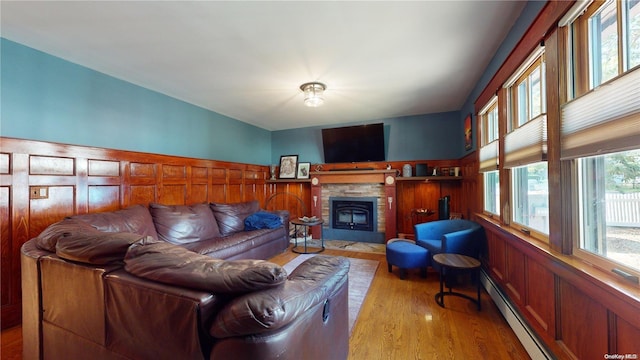 living room with light hardwood / wood-style floors and a baseboard radiator