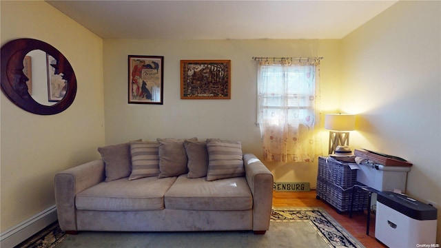 living room with hardwood / wood-style flooring and baseboard heating